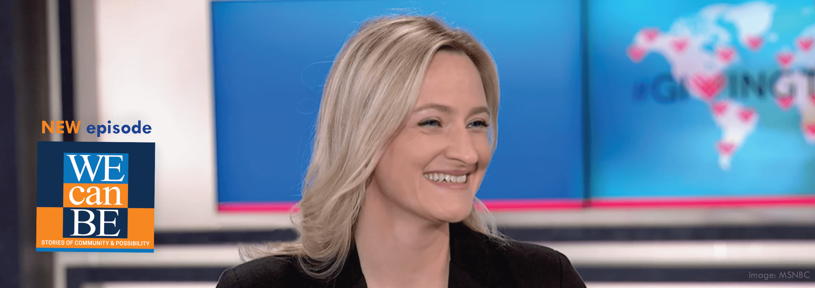 Headshot of Asha Curran, who is smiling,  has blonde hair and is wearing a black shirt.